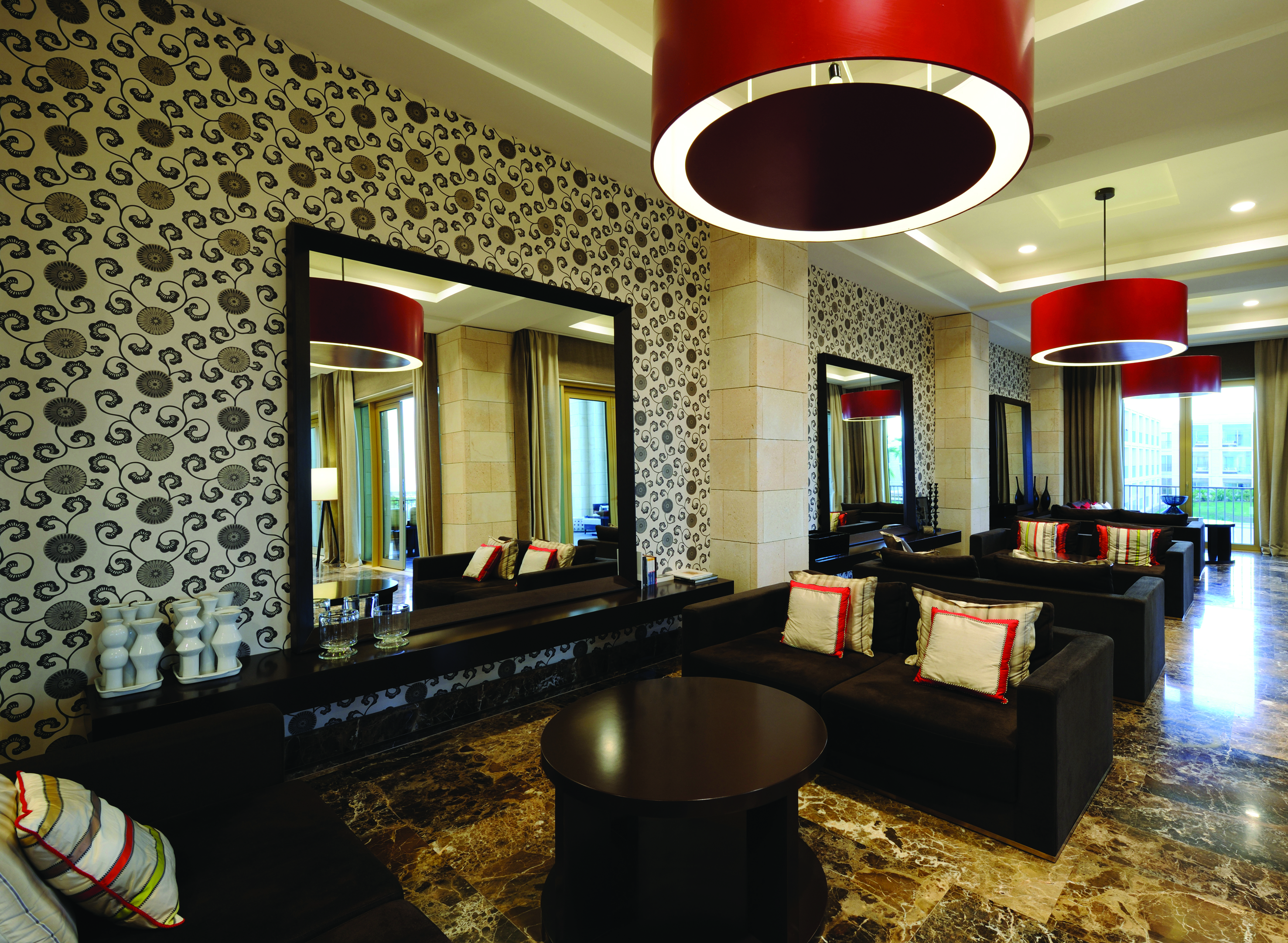 Anantara Vilamoura Portugal lobby bar with marble floors sofas and large mirrors