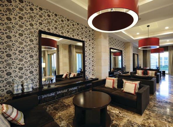 Anantara Vilamoura Portugal lobby bar with marble floors sofas and large mirrors