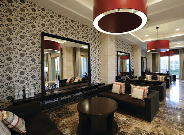 Anantara Vilamoura Portugal lobby bar with marble floors sofas and large mirrors