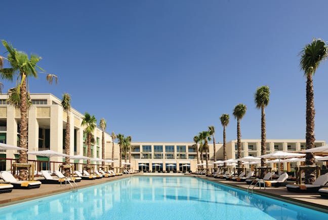 Anantara Vilamoura Portugal outdoor pool with sun loungers and umbrellas