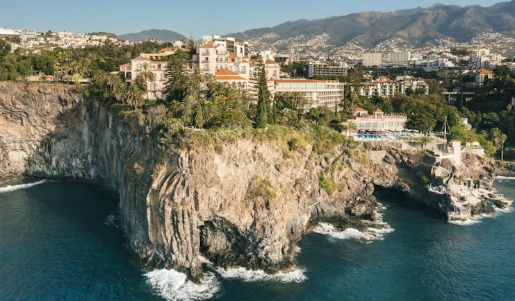 Palatial hotel on cliff overlooking sea