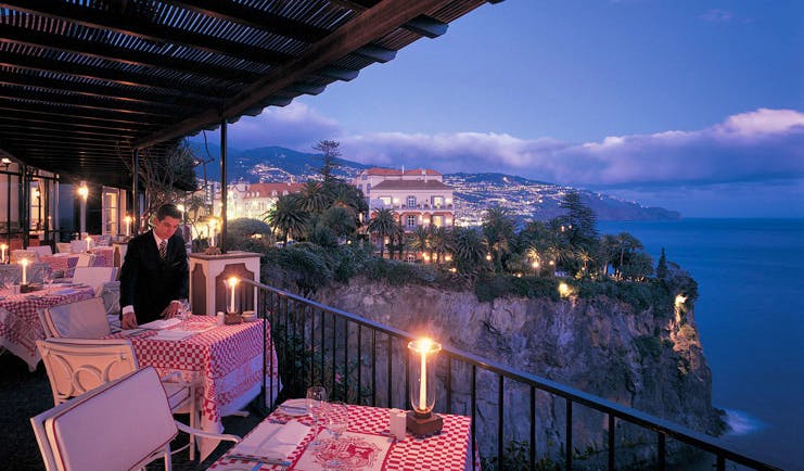 Belmond Reid's Palace Portugal terrace dining rustic table cloths cliff top sea view