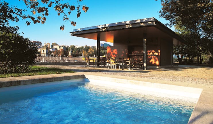 Casa da Calcada Portugal outdoor pool next to covered outdoor terrace area