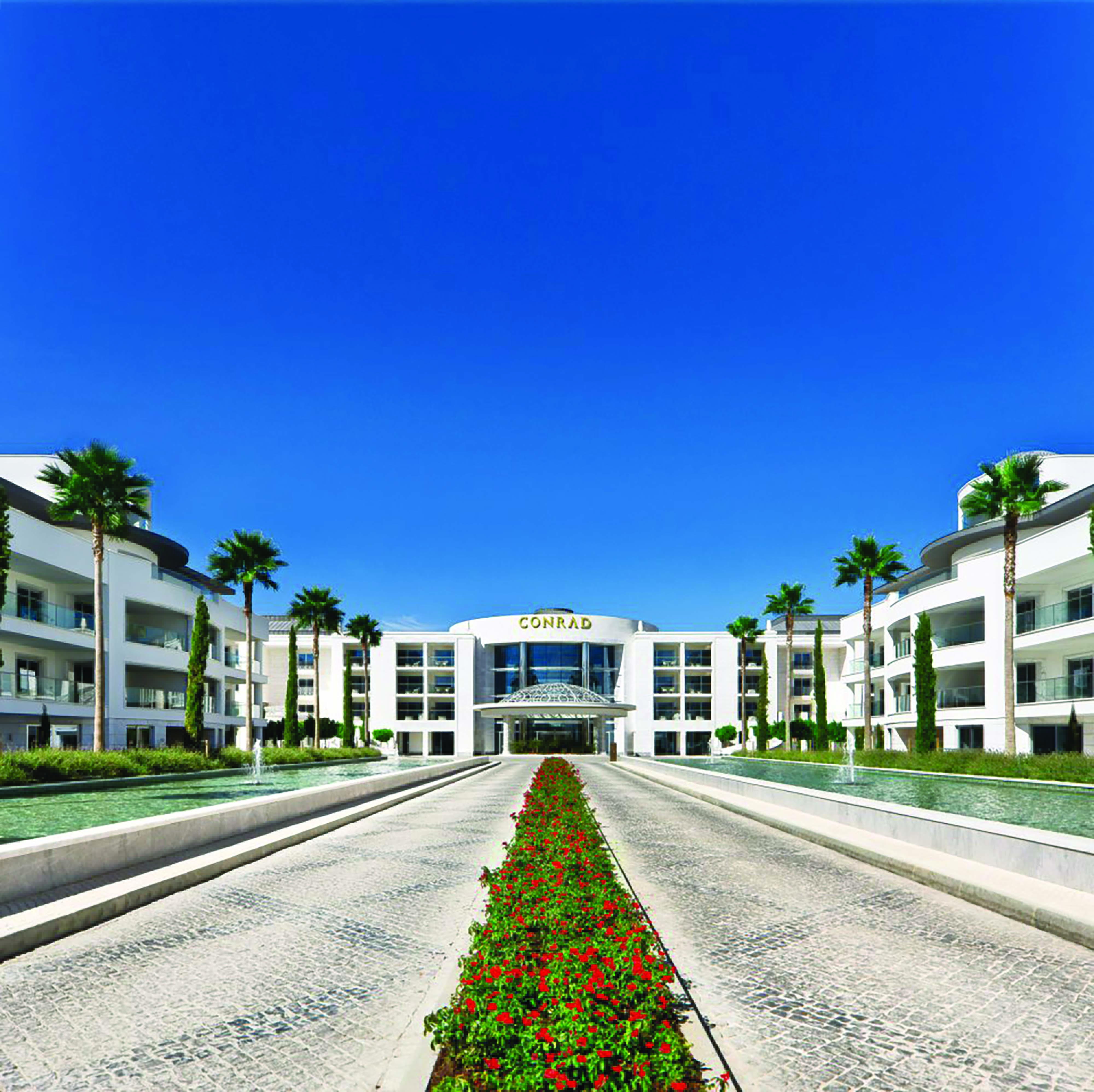 Conrad Algarve entrance, pathways leading to hotel door, fountains on each side