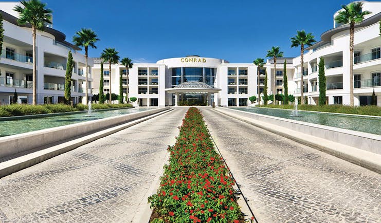 Conrad Algarve entrance, pathways leading to hotel door, fountains on each side