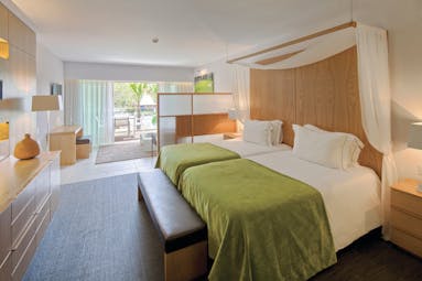 Epic Sana so suite, twin beds lounge area, balcony, colourful decor