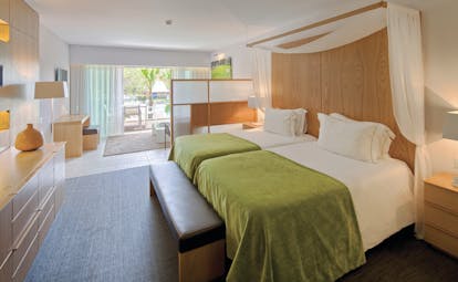 Epic Sana so suite, twin beds lounge area, balcony, colourful decor