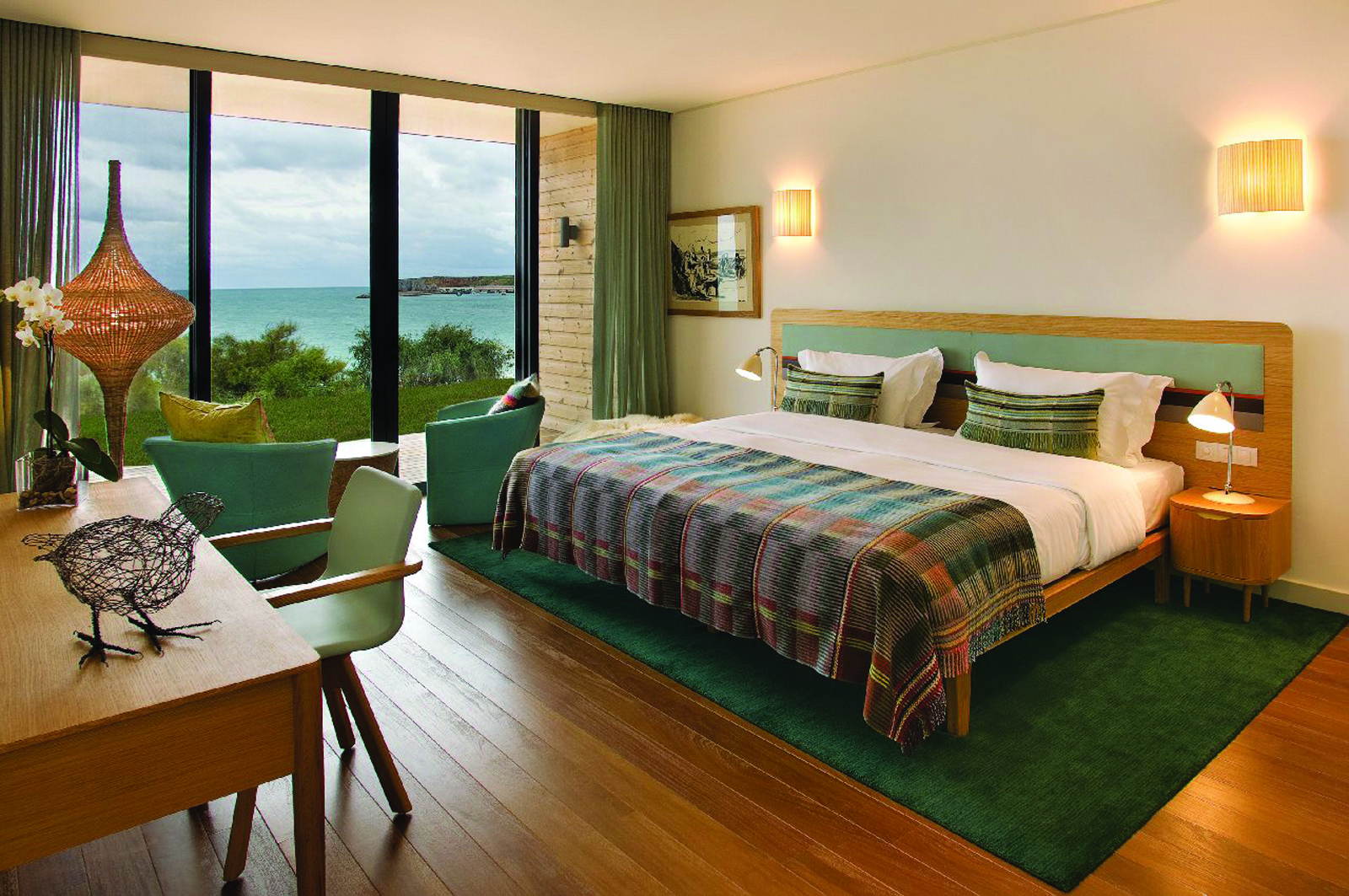 View of the beach room at the Martinhal Beach Resort and Hotel including a large double bed, big windows looking over the sea