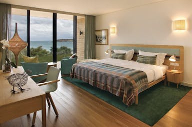 View of the beach room at the Martinhal Beach Resort and Hotel including a large double bed, big windows looking over the sea