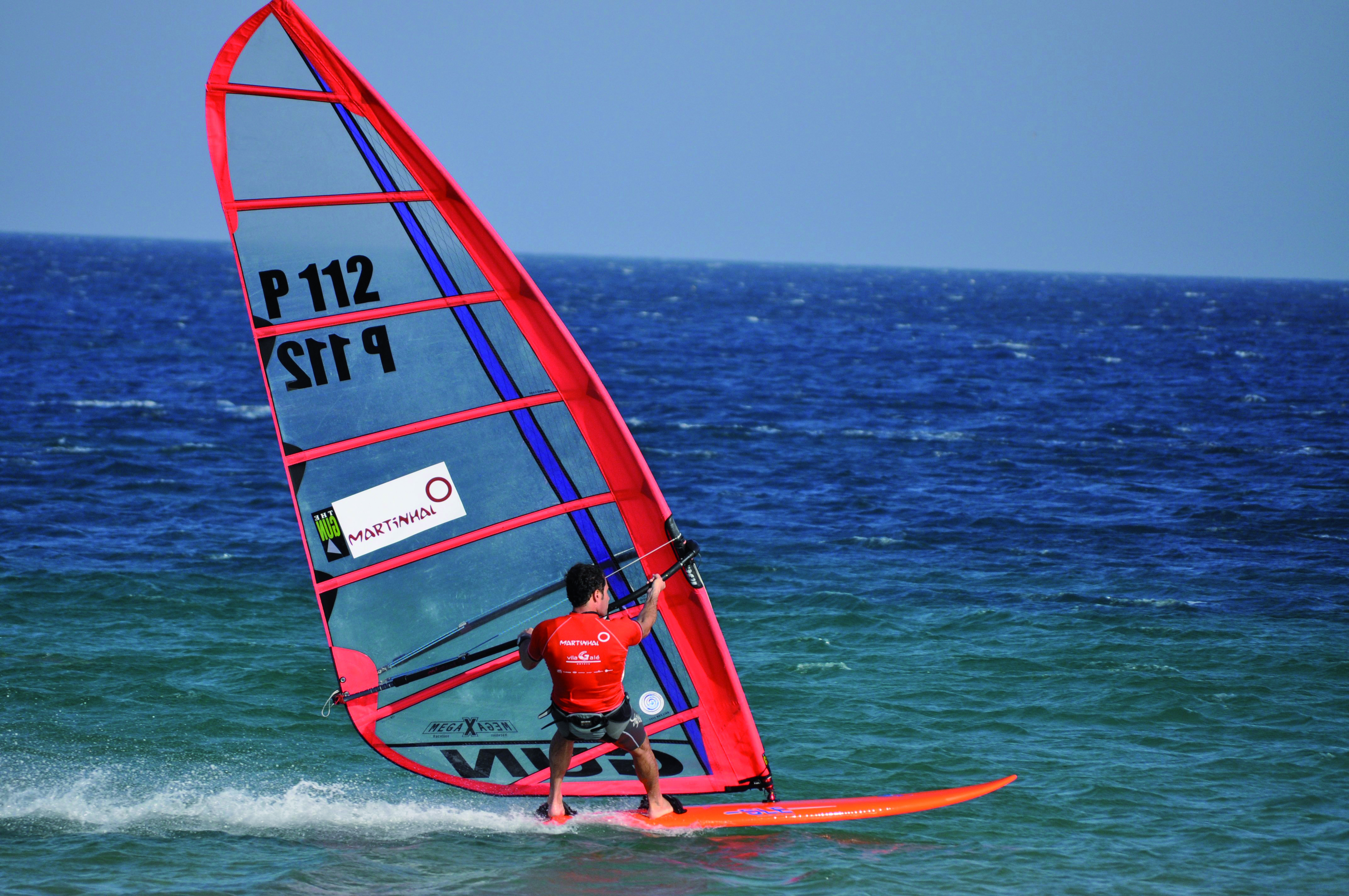 a man windsurfing in the sea