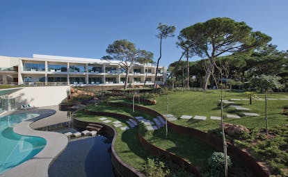 Martinhal Cascais Portugal aerial exterior view of white buildings and lawns leading to outdoor pool