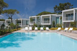 Martinhal Cascais Portugal exterior pool white buildings with balconies overlooking outdoor pool with loungers