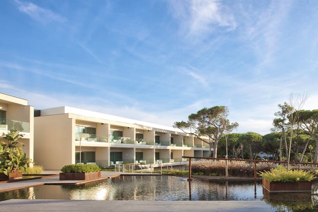 Martinhal Cascais Portugal hotel exterior white buildings with balconies overlooking ponds