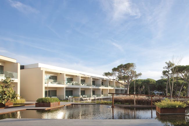 Martinhal Cascais Portugal hotel exterior white buildings with balconies overlooking ponds