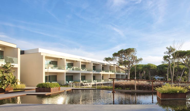 Martinhal Cascais Portugal hotel exterior white buildings with balconies overlooking ponds