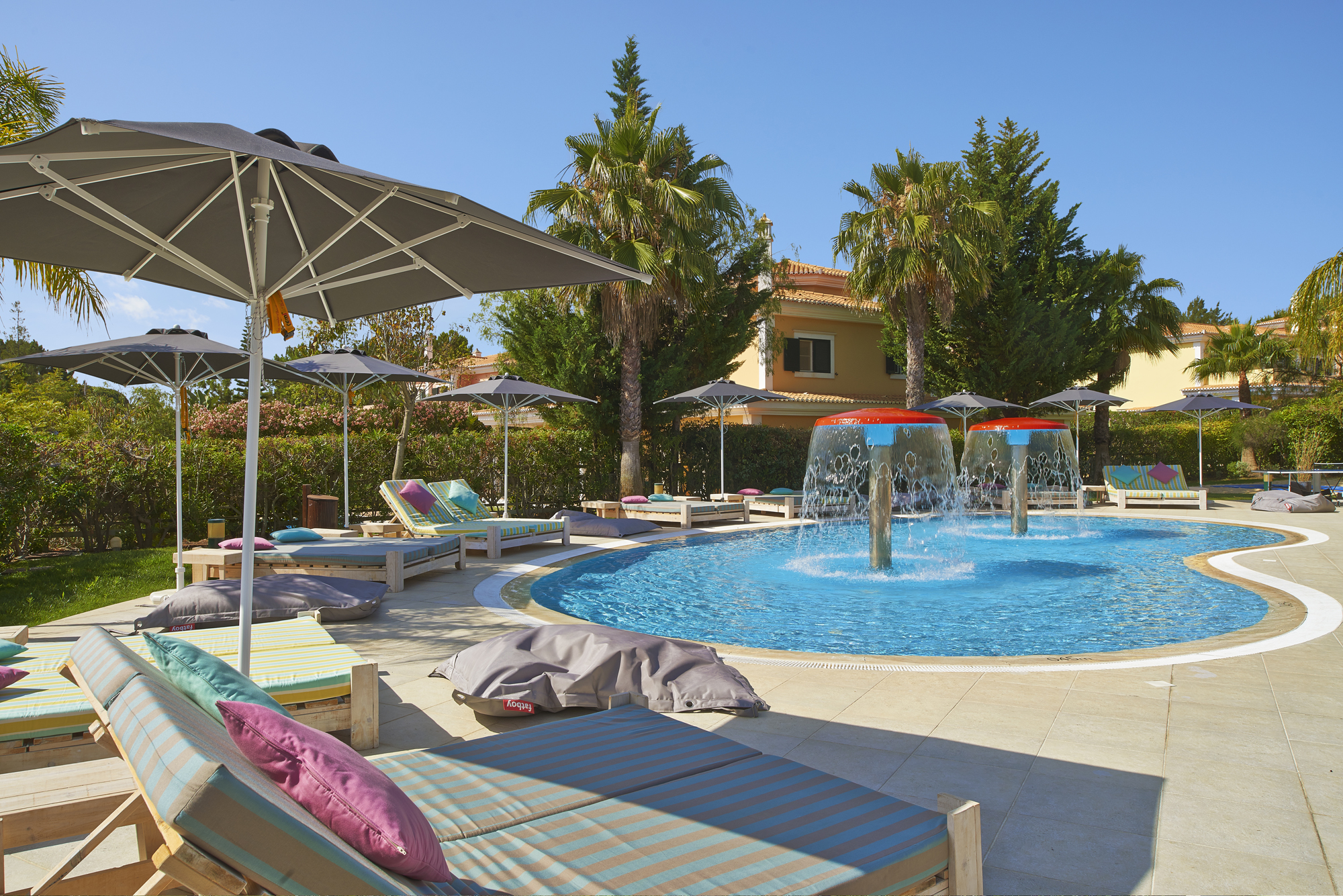 Martinhal Quinta Portugal childrens pool with cascade showers and sun loungers