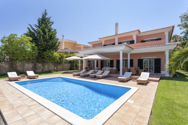 Martinhal Quinta Portugal luxury villa pool sun loungers and umbrellas