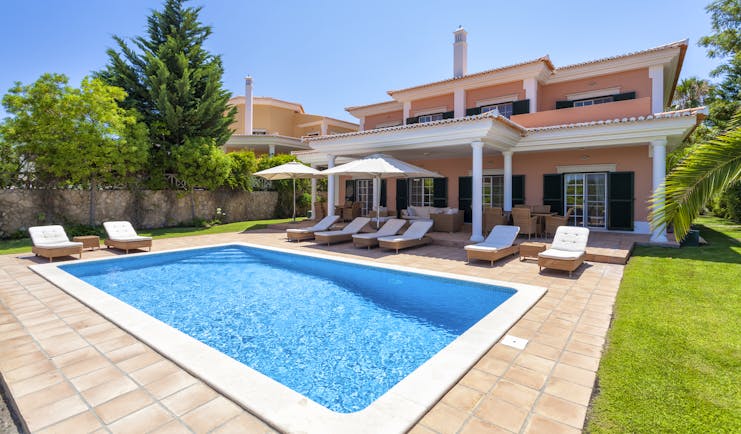 Martinhal Quinta Portugal luxury villa pool sun loungers and umbrellas