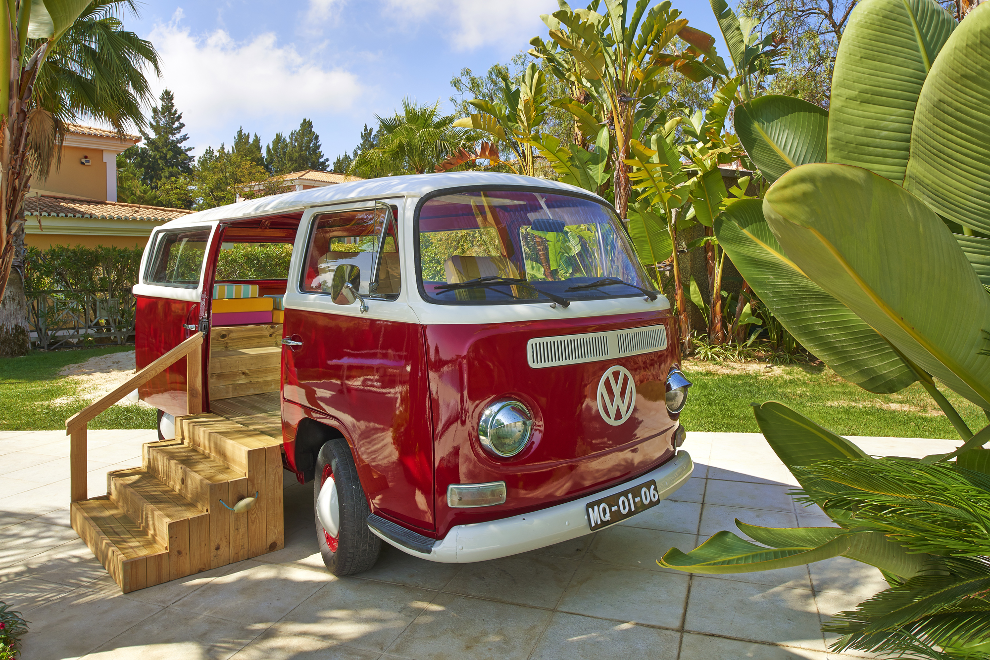 Martinhal Quinta Portugal outdoor pool woman holding a baby next to childrens pool and children in main pool