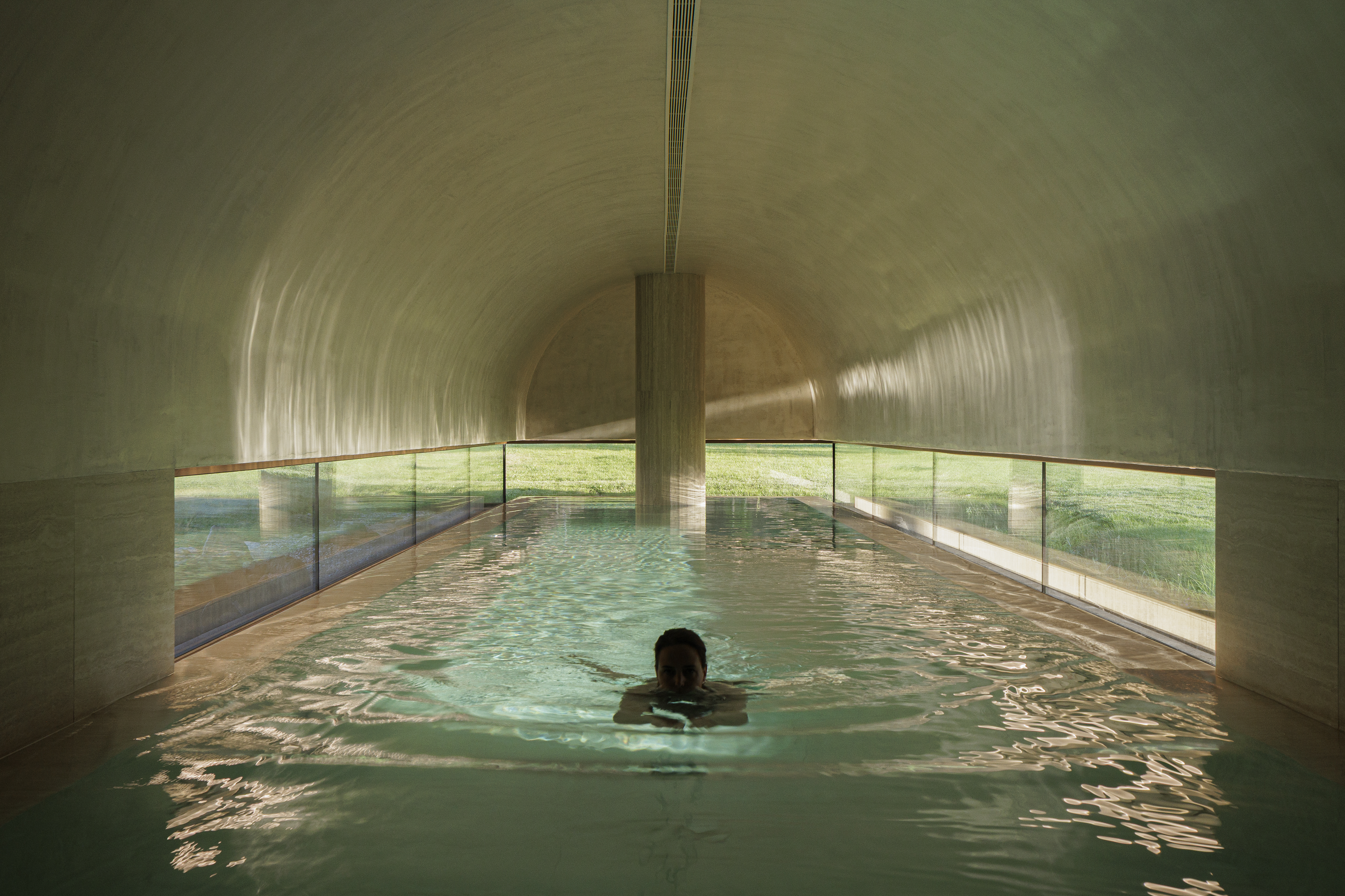 Mosterio de Arouca spa pool in a tunneled room with windows at ground level looking out onto hotel grounds