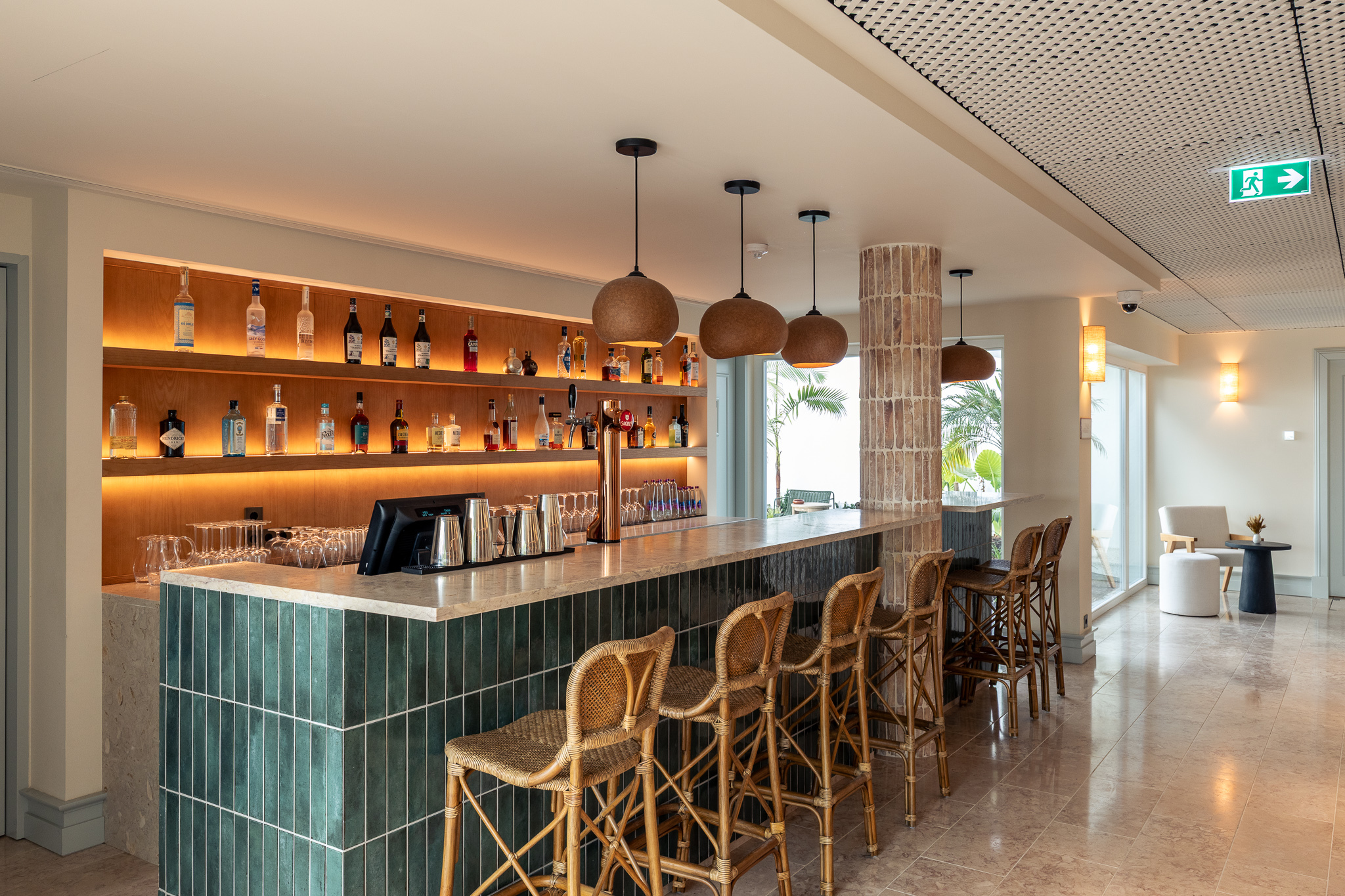 Palacio de Tavira Bar da Lua, with blue-tiled bar, lit shelves of wine and spirits, and wooden bar stools