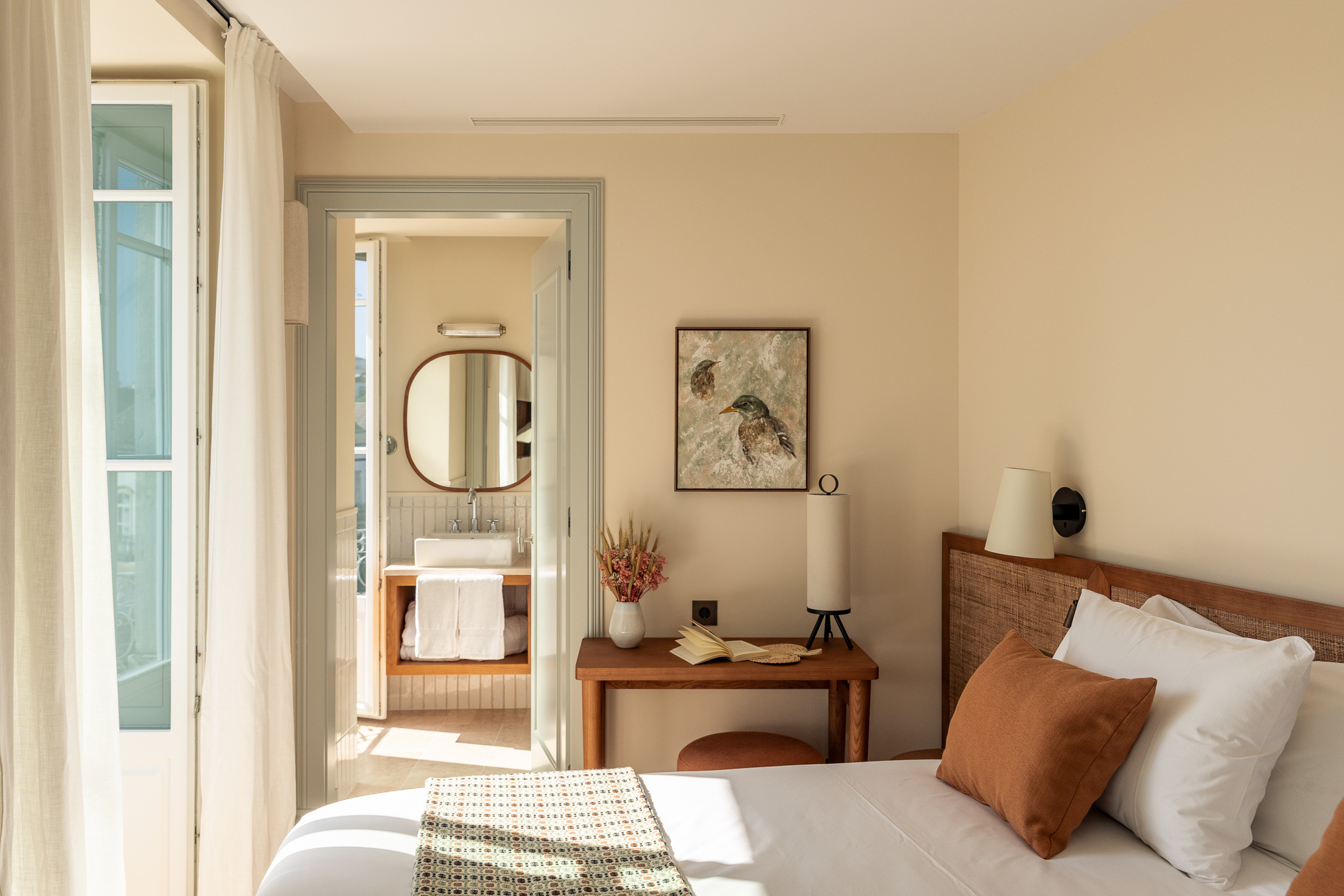 Palacio de Tavira Standard room in neutral tones with french doors and twin beds