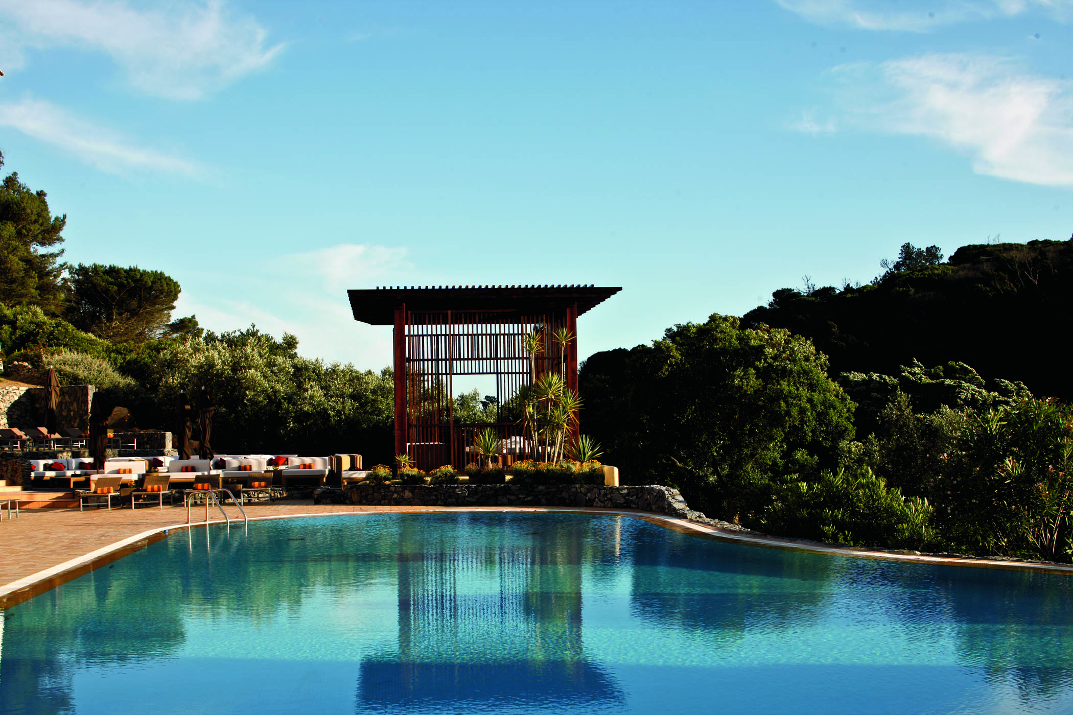 Penha Longa Portugal outdoor infinity pool with pagoda next to seating area