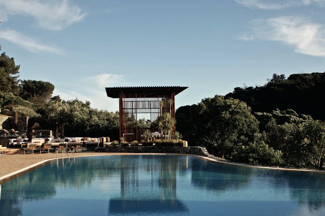 Penha Longa Portugal outdoor infinity pool with pagoda next to seating area