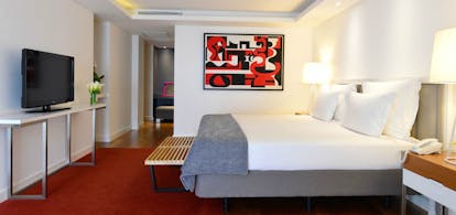 Pestana Cidadela Cascais presidential suite, double bed, television, modern art on walls