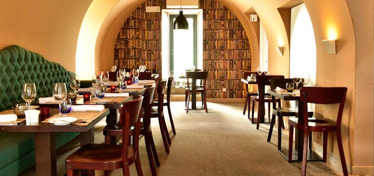 Pestana Cidadela Cascais restaurant, tables and chairs, curved ceiling, traditional taverna decor