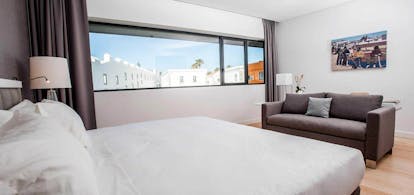 Pestana Cidadela Cascais superior room, double bed, sofa, light bright decor