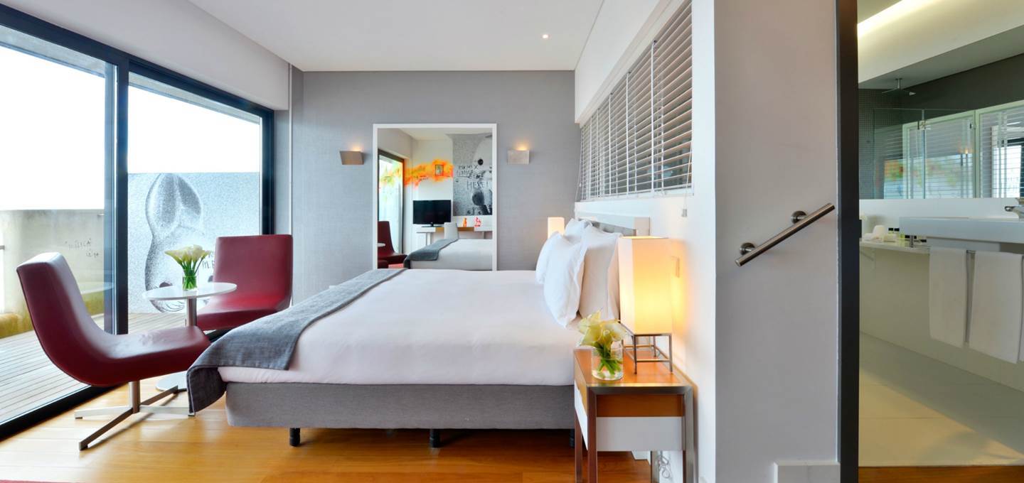 Pestana Cidadela Cascais superior sea view room, double bed, doors leading to balcony, unique art work