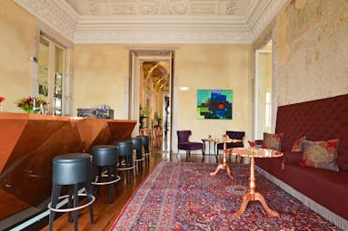 Pestana Palacio do Freixo Bar Nasoni, leather bar stools, wooden bar, antique rug, intricate architecture