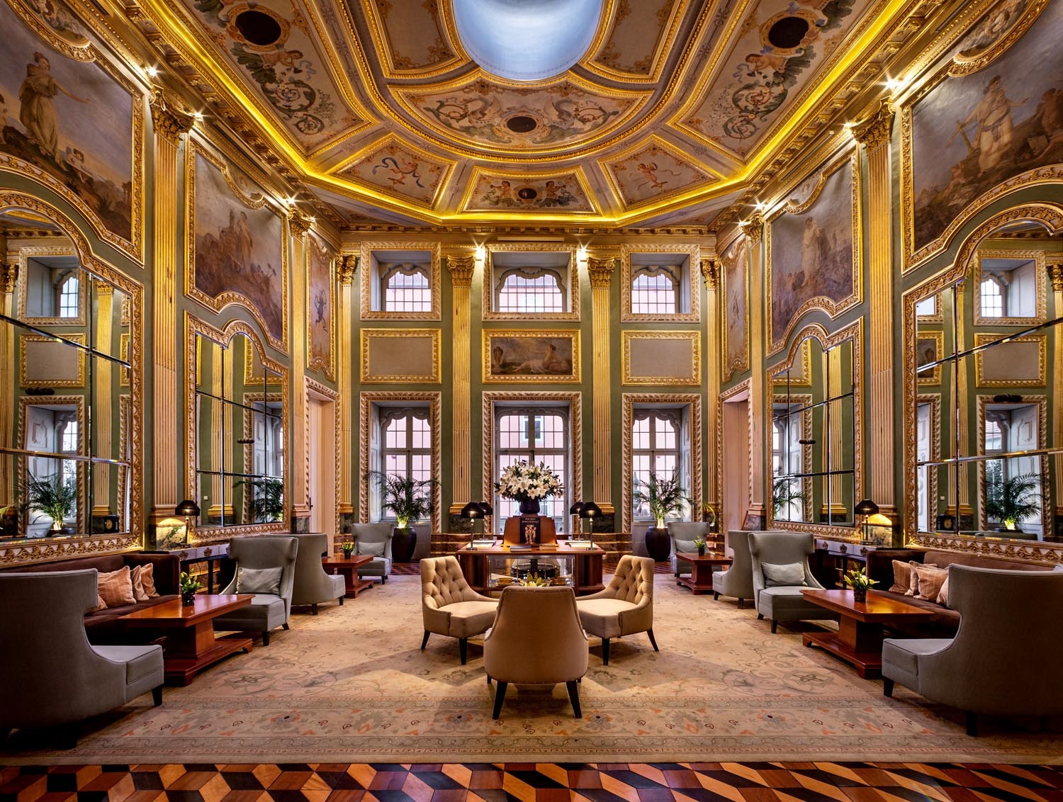 Pestana Palacio do Freixo lobby, ornate painted ceilings and frescoes and gold gilting, leather armchairs 