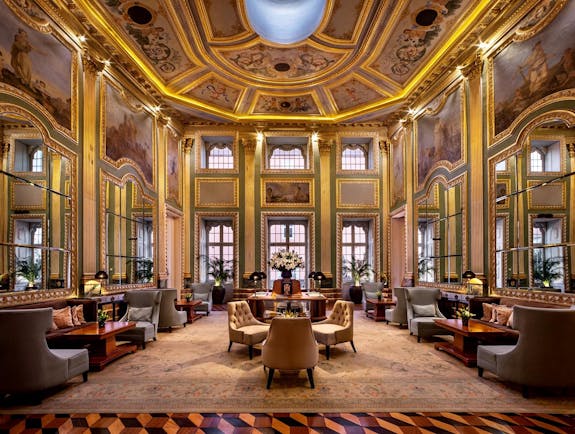 Pestana Palacio do Freixo lobby, ornate painted ceilings and frescoes and gold gilting, leather armchairs 