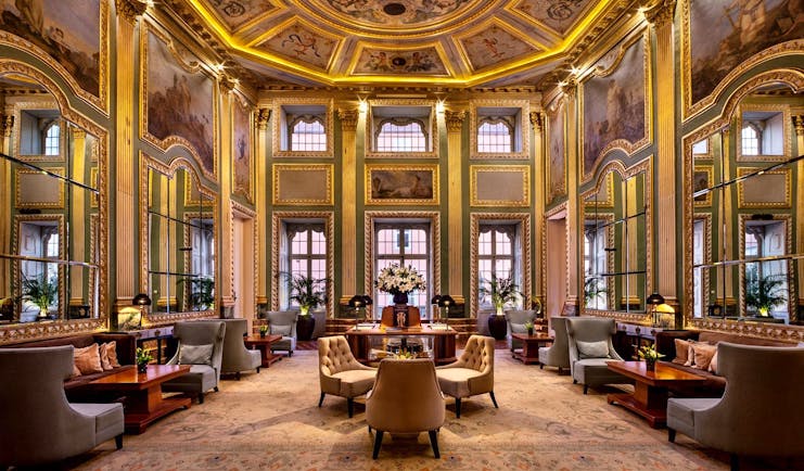 Pestana Palacio do Freixo lobby, ornate painted ceilings and frescoes and gold gilting, leather armchairs 