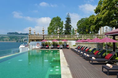 Pestana Palacio do Freixo pool, overlooking river, sun loungers with parasoles