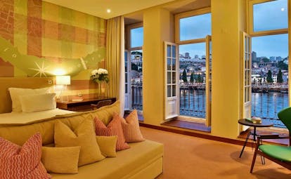 Pestana Vintage Porto river view room, double bed, french windows leading to balcoy, views over river