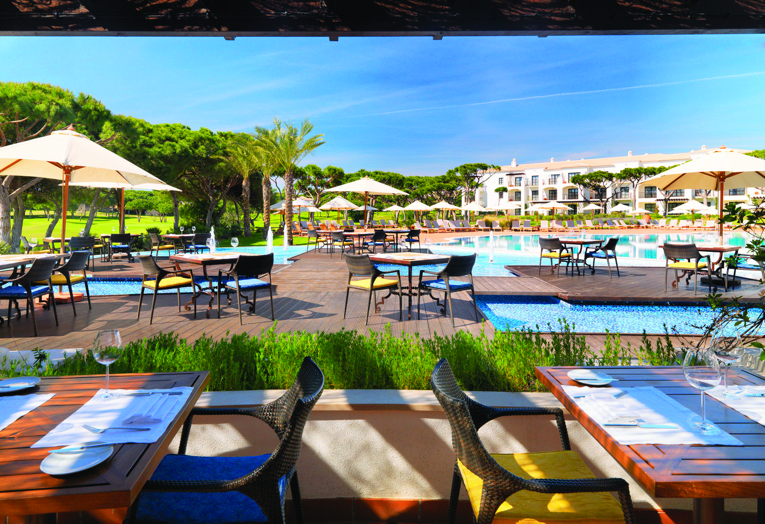 Pine Cliffs Residence Portugal grill restaurant outdoor decked dining area next to swimming pool