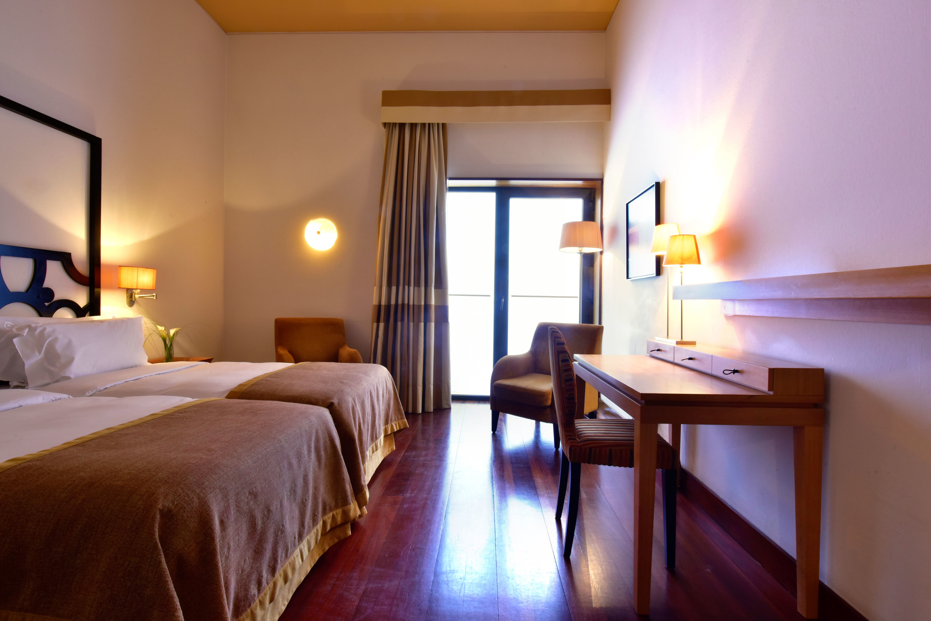 Pousada Convento de Tavira classic room, double bed, modern decor, door leading to terrace