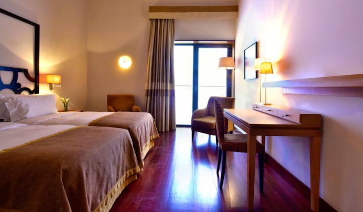 Pousada Convento de Tavira classic room, double bed, modern decor, door leading to terrace