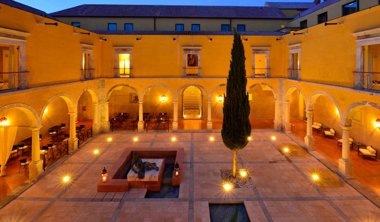 Pousada Convento de Tavira courtyard at sunset, colonnaded cloisters