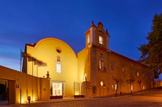 Pousada Convento de Tavira exterior at night, historic hotel building