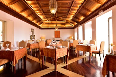 Pousada Convento de Tavira restaurant, tables and chairs, wood panelled ceiling