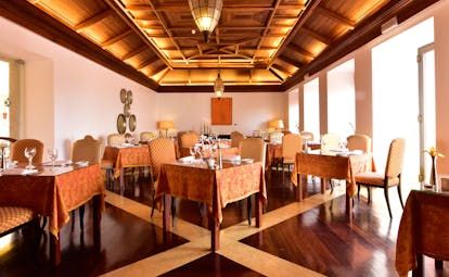 Pousada Convento de Tavira restaurant, tables and chairs, wood panelled ceiling