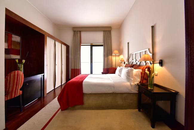 Pousada Convento de Tavira superior room, bed, modern decor, door leading to terrace