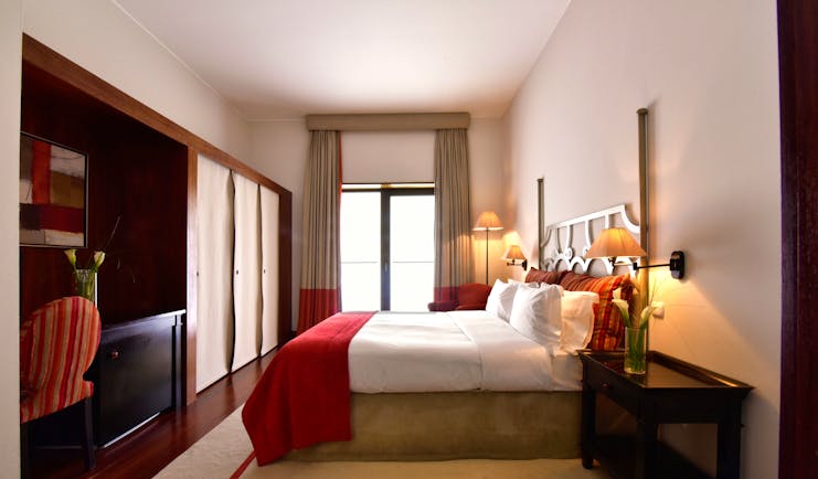 Pousada Convento de Tavira superior room, bed, modern decor, door leading to terrace