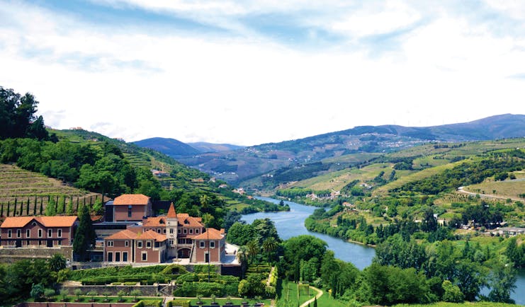 Six Senses Douro Valley Portugal aerial panorama of complex of buildings in a valley next to a river
