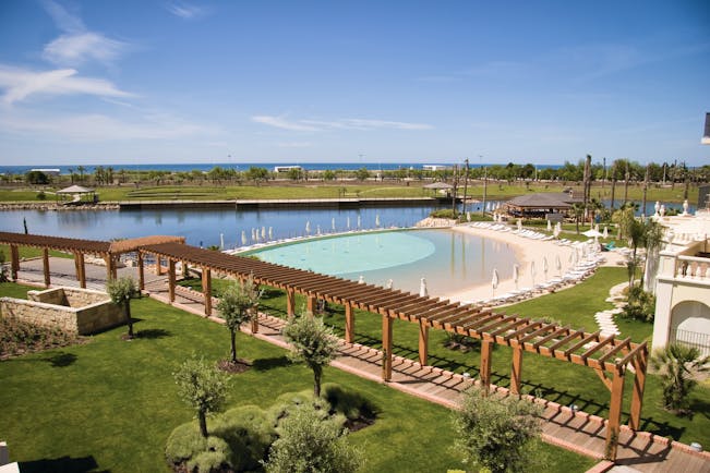 The Lake Spa lake and pools, sun loungers, gardens, sea in background