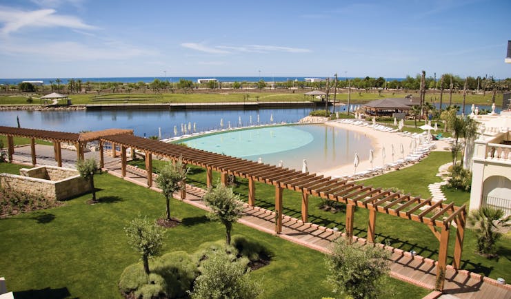 The Lake Spa lake and pools, sun loungers, gardens, sea in background